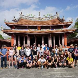 A group photo taken at a temple