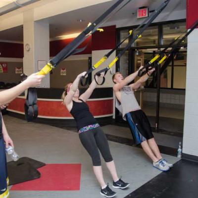 Students use the TRX Suspension Trainer in the TARC?s Semler Fitness Center in January 2014. TRX ...